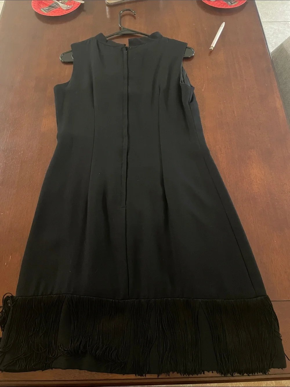 Elegant Black Sleeveless Midi Dress with Bow & Fringe Detail
